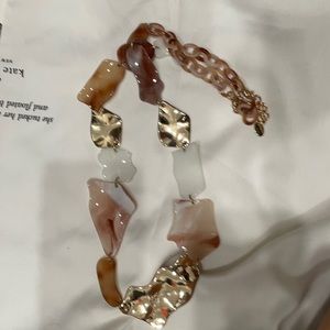 Gold and cream long necklace.